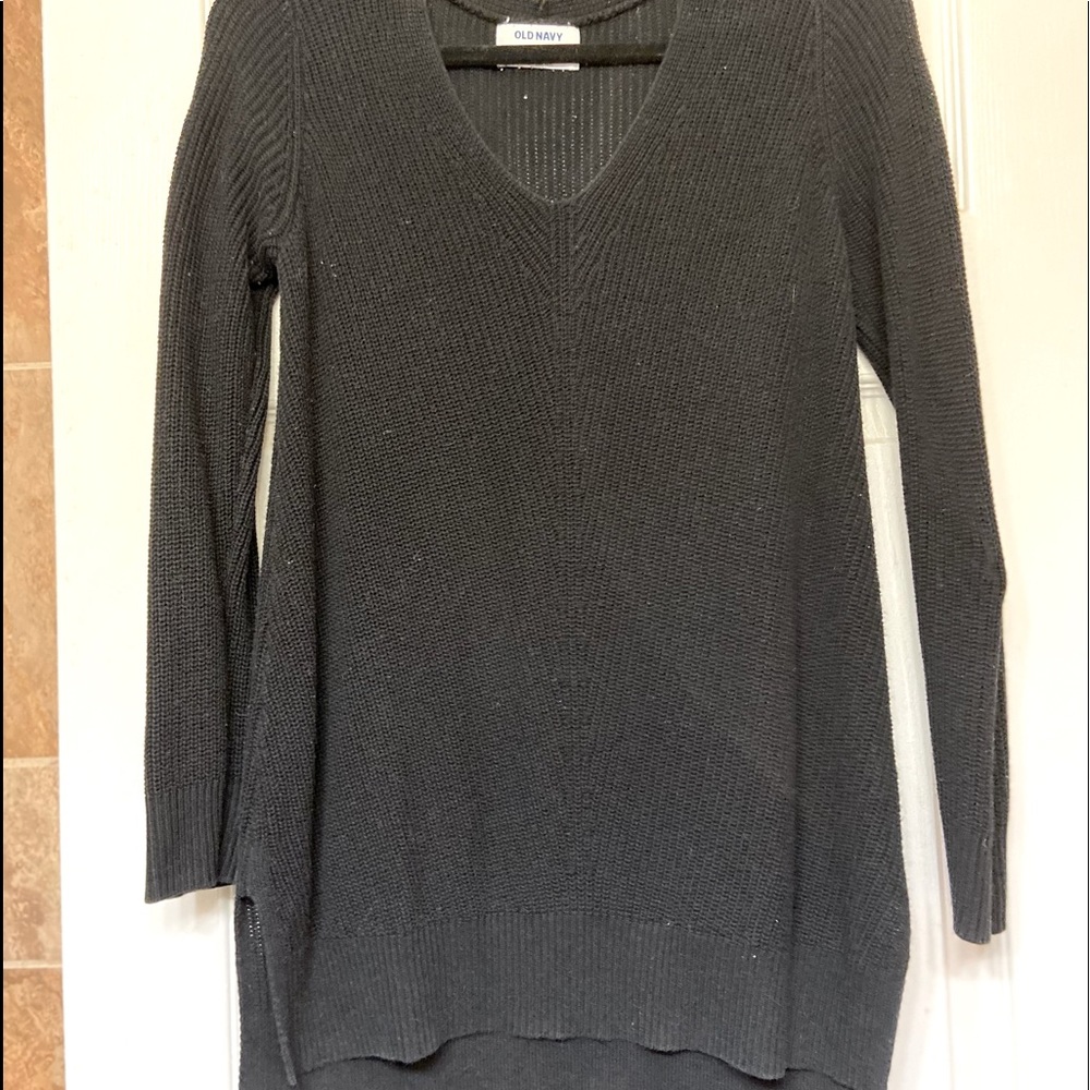 Womens size medium knit sweater. V neck. Slit down sides at bottom.
